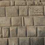 Fine Inca stonework and snake marking suggest a former royal residence in Cusco, Peru