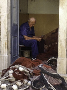 Fisherman tending his nets, Hvar Island, the Adriatic jewel ofCroatia's Dalmatian coast