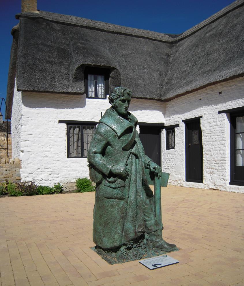 Clare statue in courtyard of Helpston cottage