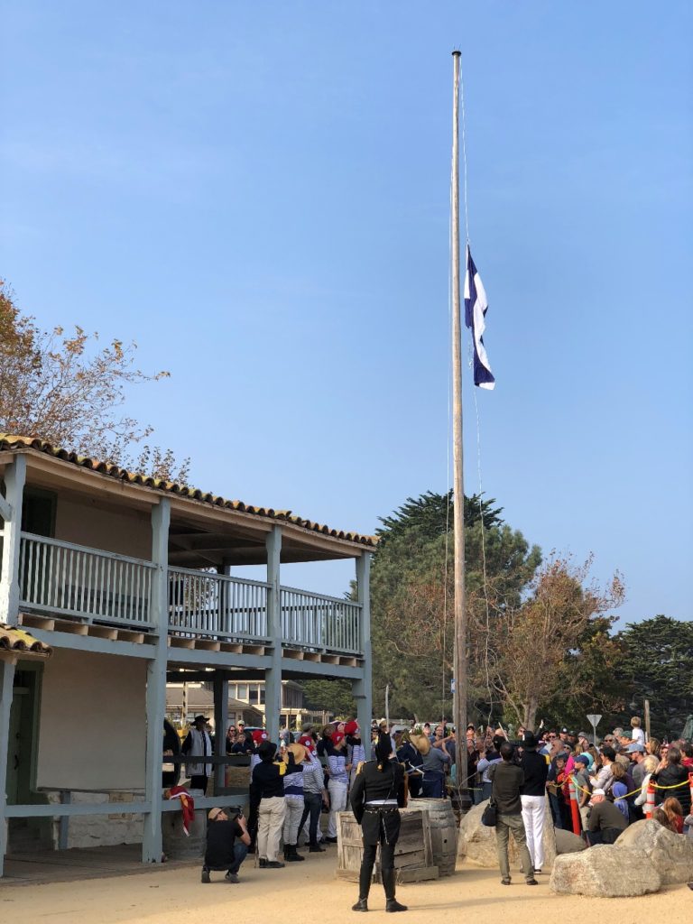 Bouchard salutes as the flag of Argentina is raised over the Custom House, Monterey, California