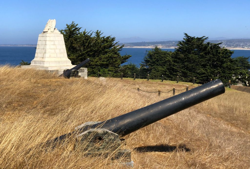 Cannons of Fort Mervine and the Sloat Monument overlook the bay, Monterey, California