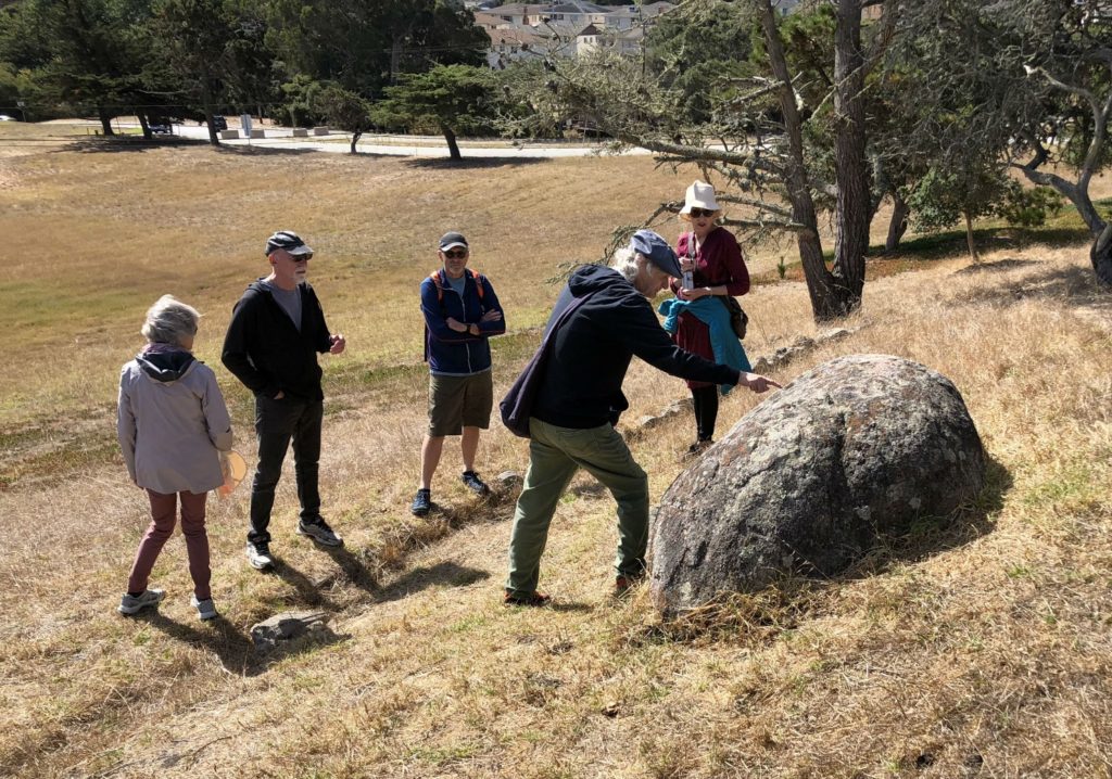 Historian Tim Thomas points to the Rain Rock, Monterey, California