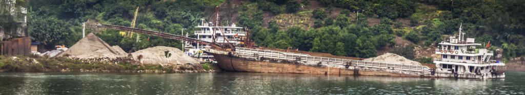 Sand and gravel hauler being unloaded on the Yangtze River, Chongqing, China, Three Gorges Cruise