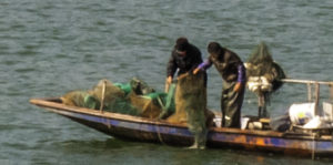 Fishermen check their nets, Yangtze River, China