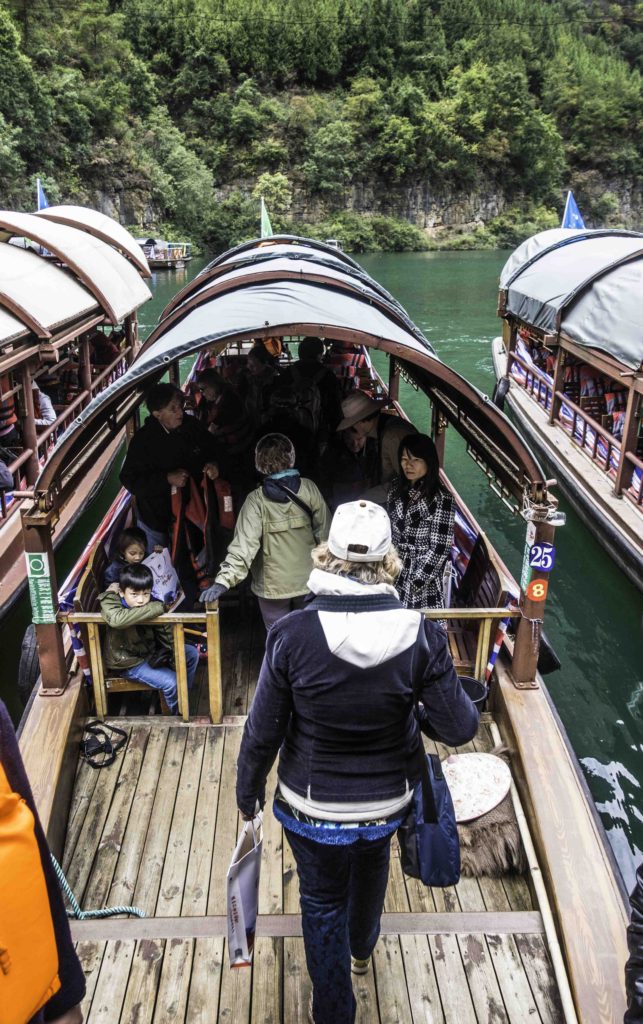 Boarding sanpans for the Three Small Gorges tour on the Madu River, Yangtze River Three Gorges Cruise, Chongqing, China