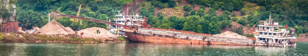 Sand and gravel hauler being unloaded on the Yangtze River, Chongqing, China, Three Gorges Cruise 