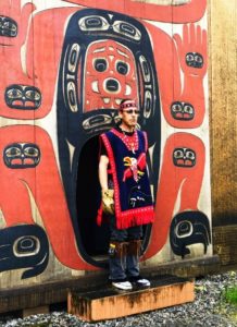 Greeter in Eagle clan robe at Chief Shakes House, Wrangell, Alaska