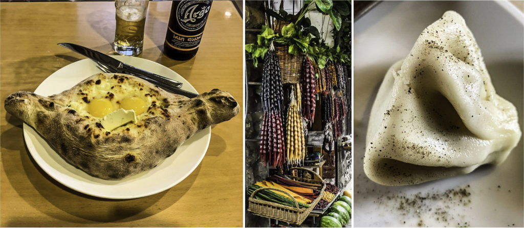 Georgian cuisine: khachapuri (left), snacks (churchkhela hanging on the threads, tklapi in the basket), and khinkali (right), T'bilisi, Republic of Georgia