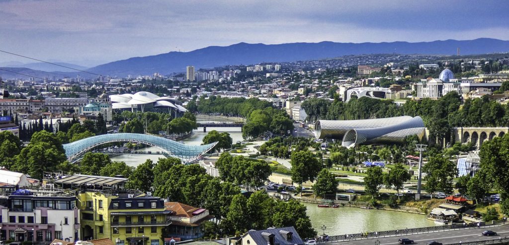 New T'bilisi along the Mtkvari River: Bridge of Peace, the mushroom-like roof of the Public Service Hall, and the two tubes of the Rike Concert Hall & Exhibition Center. You may also spot the glass dome of the new Presidential Palace on the right, T'bilisi, Republic of Georgia