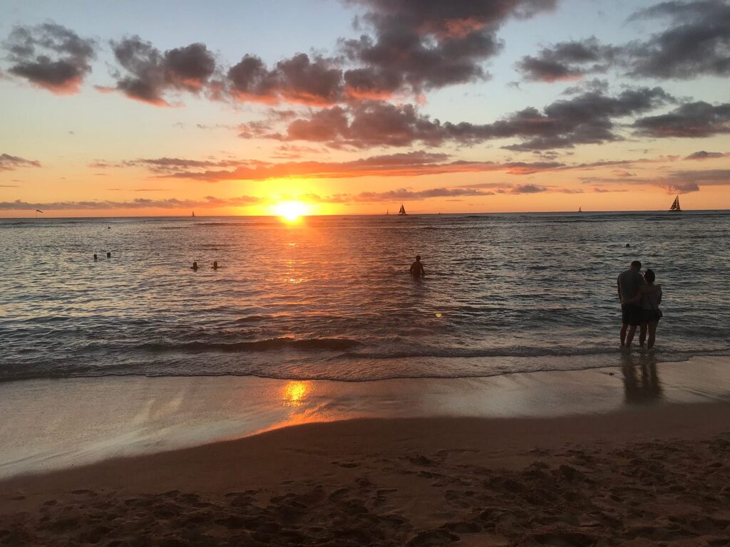 Sunset at Kaimana Beach with windsock faintly visible on the left. (Photo by Carol Canter)